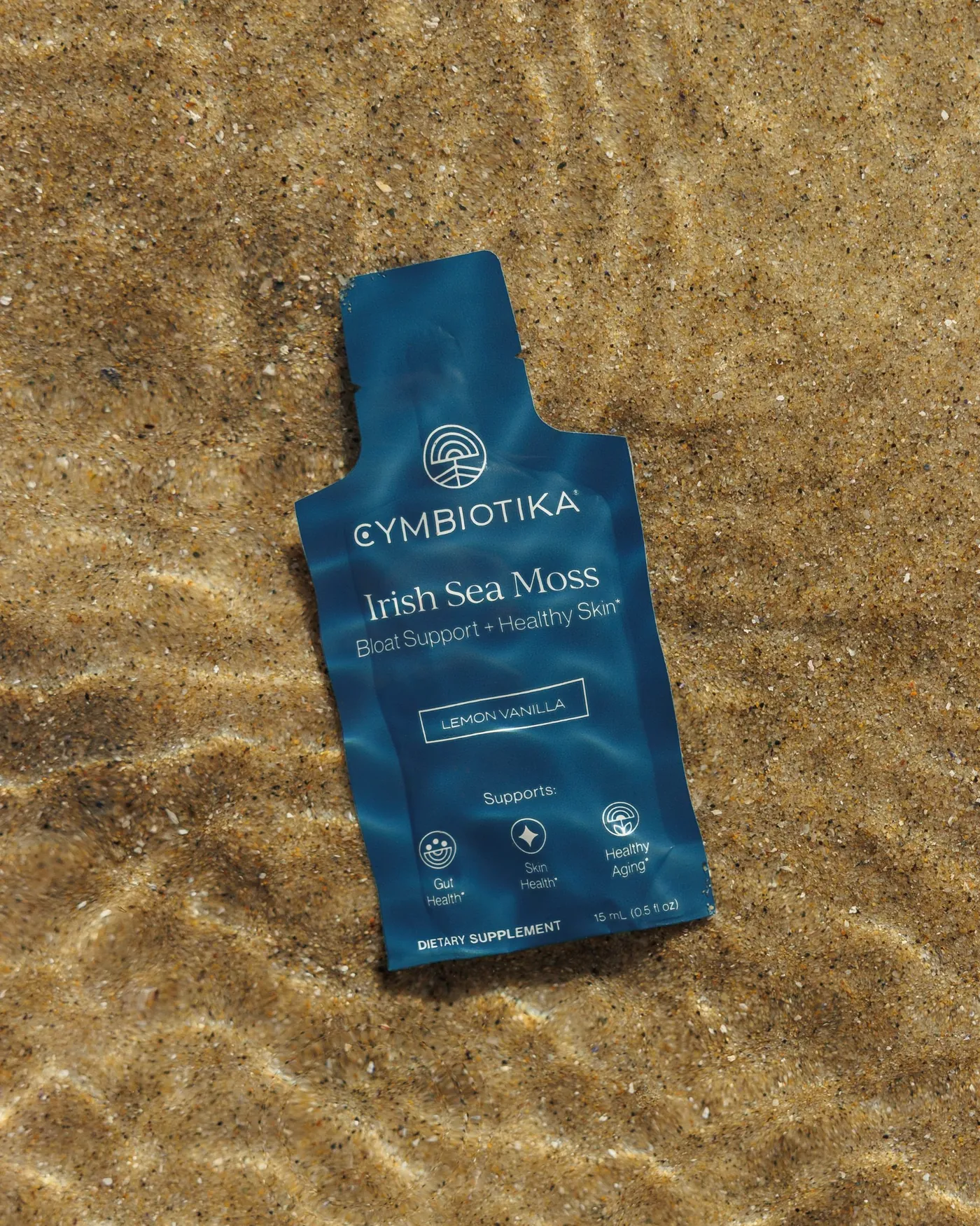 Irish Sea Moss packet under water on sand